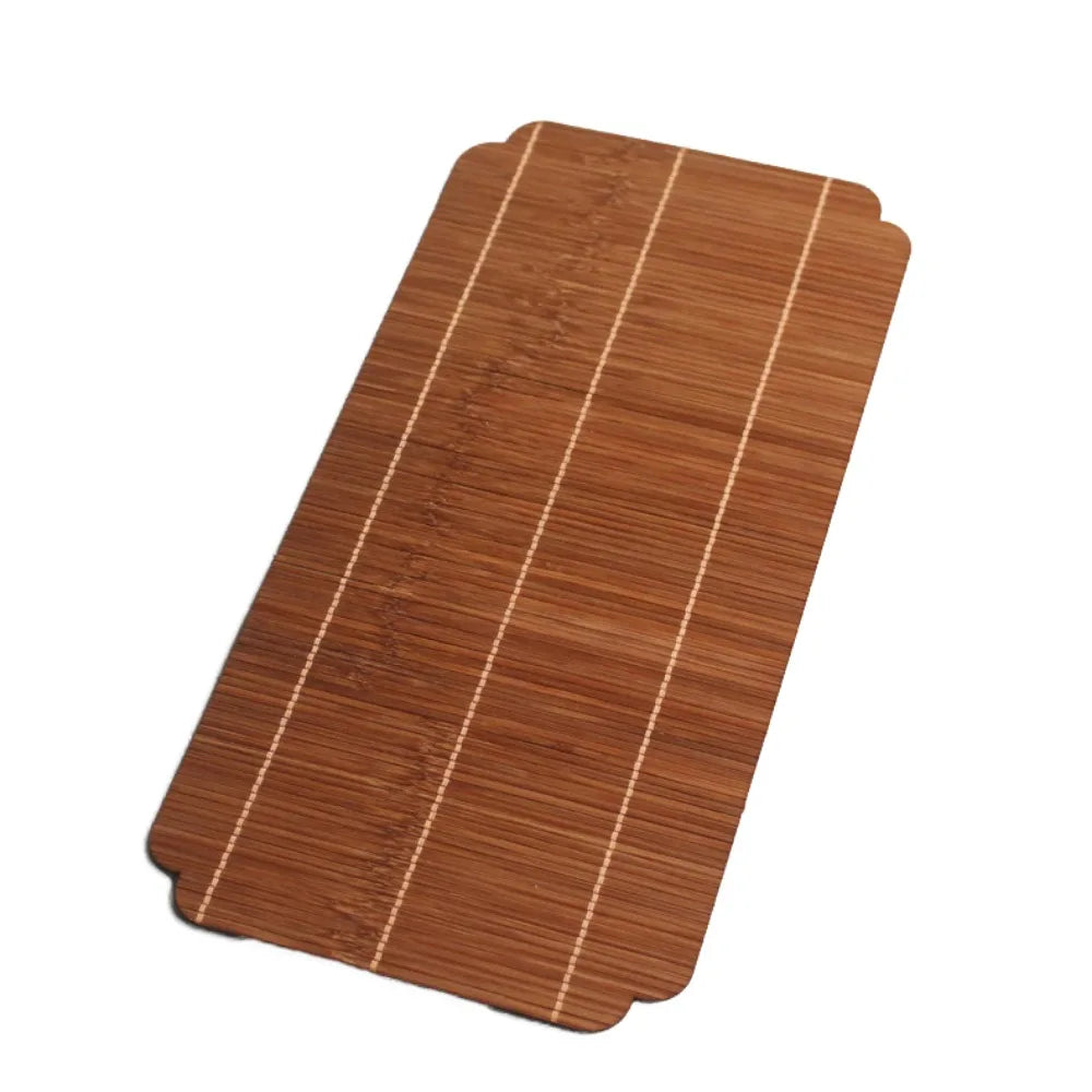 A rectangular brown bamboo tea mat with parallel light-colored stripes.