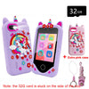 A purple kids smart phone toy with a pink case and a 32GB memory card is shown.