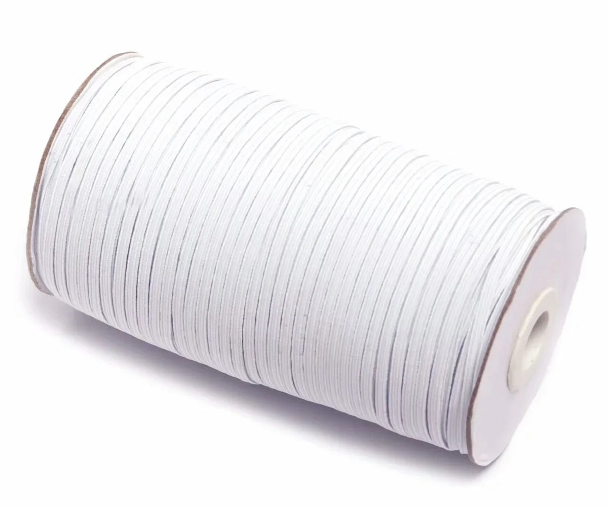 A roll of white polyester elastic bands for sewing and crafts.