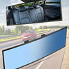 Wide angle convex car interior rear view mirror showing a vehicle driving on a road.