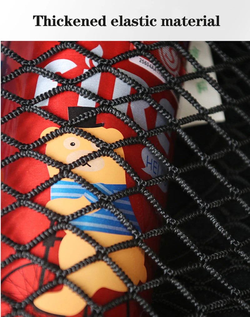 A close-up of a red container with an orange bear toy visible through a black elastic mesh storage bag.