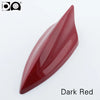 A glossy, dark red 5D shark fin car antenna painted in piano paint.