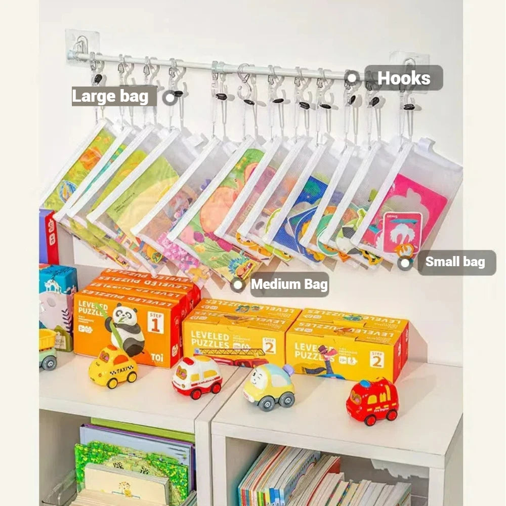 A display of eight transparent mesh zipper pouches in large, medium, and small sizes with various colored designs.