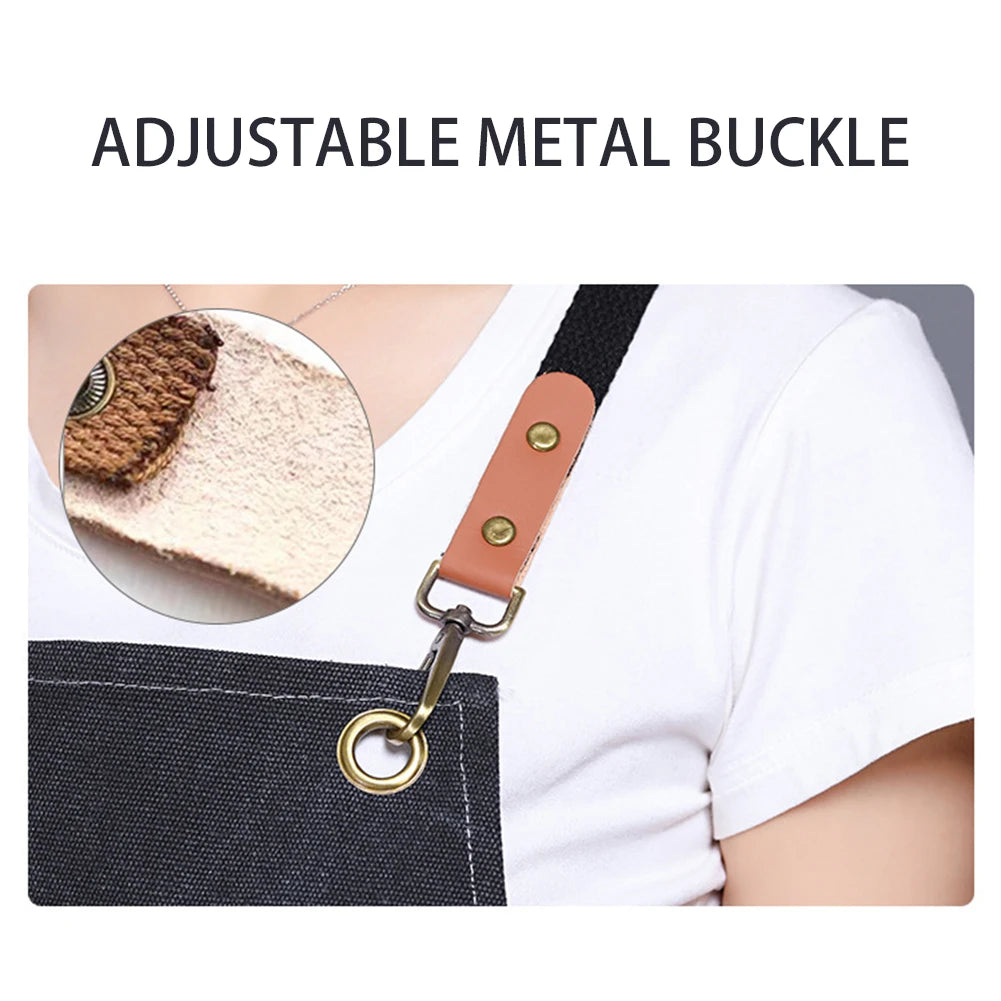 Adjustable metal buckle attached to a black canvas apron with a large front pocket.