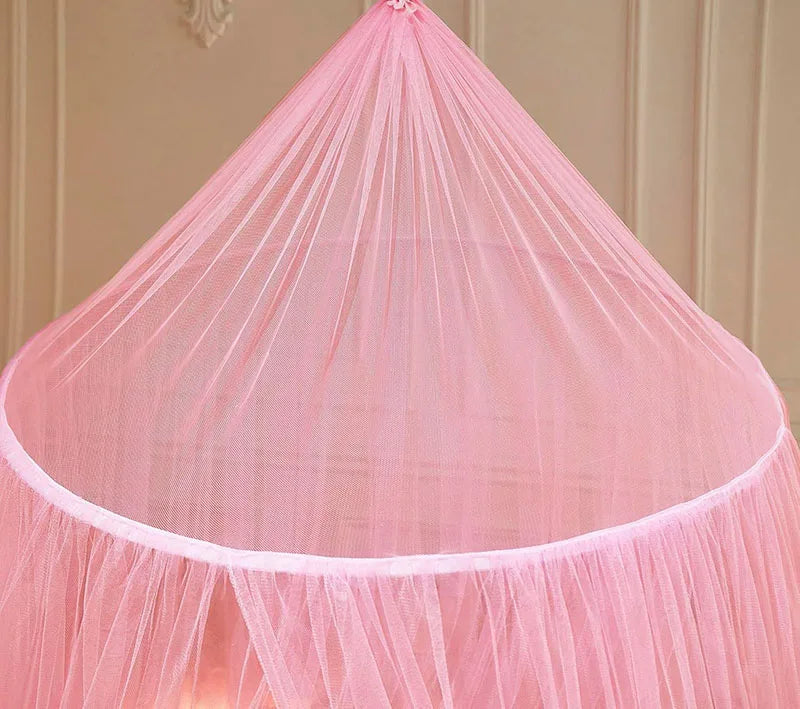 Pink installation-free dome mosquito net covering a single bed area