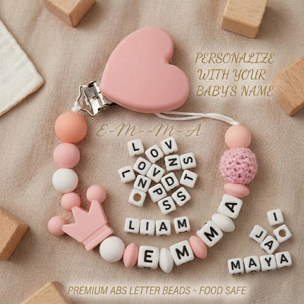 Pink heart-shaped pacifier clip with custom name letter beads for a baby