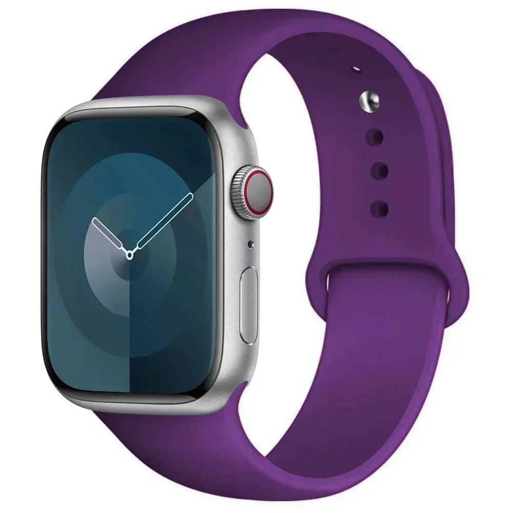 A purple silicone sport band worn around an Apple Watch.