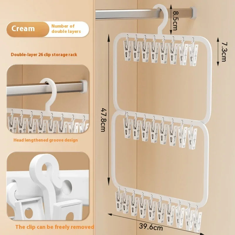 A beige wall-mounted clip storage rack with multiple double-layer clips for laundry drying.