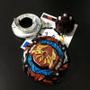 A metal battle spinning top with a dark red and blue design is shown next to some small components.
