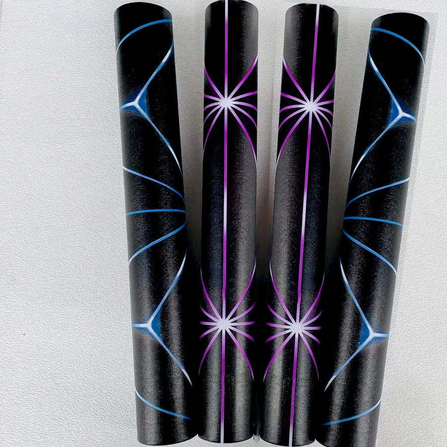 A set of four black tubes featuring luminous purple and blue star patterns for self-adhesive wallpaper.