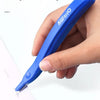 A hand holds a blue magnetic staple remover pen with an ergonomic grip, demonstrating its use.