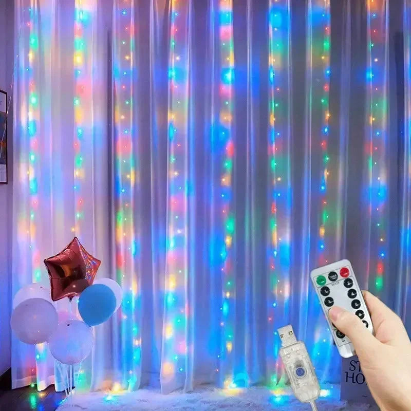 A vertical curtain of blue and purple LED string lights illuminated with colorful lights, with a hand holding a remote contro