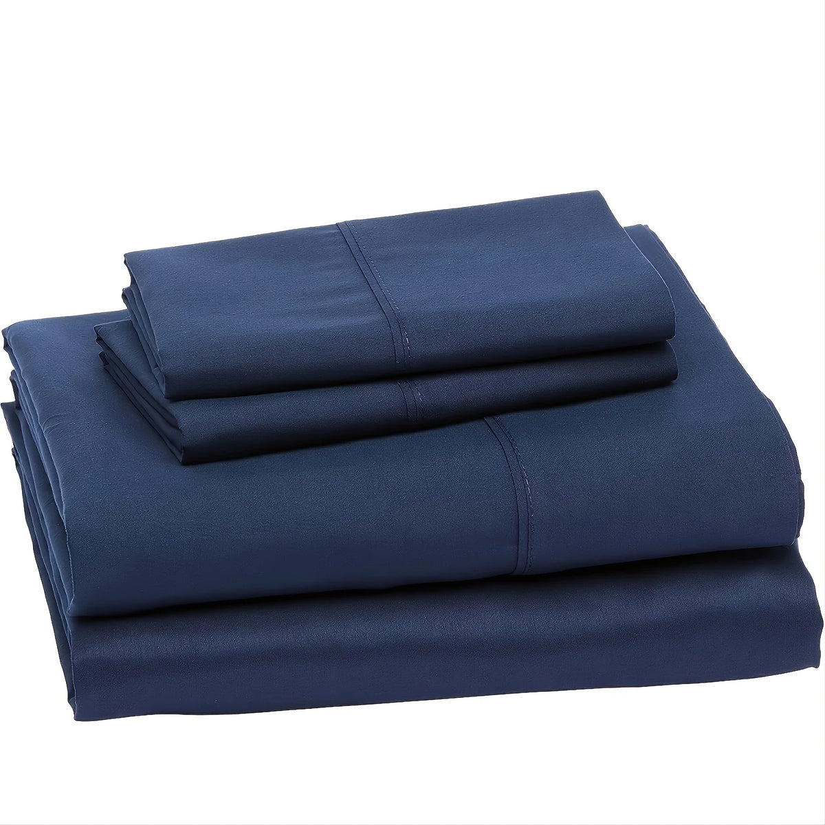 A stack of dark blue microfiber bed sheets folded neatly for a hotel luxury set.
