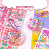 Buntes Set Kawaii-Cartoon-Tier-Scrapbook-Sticker mit niedlichen Figuren auf rosa und lila Blättern.