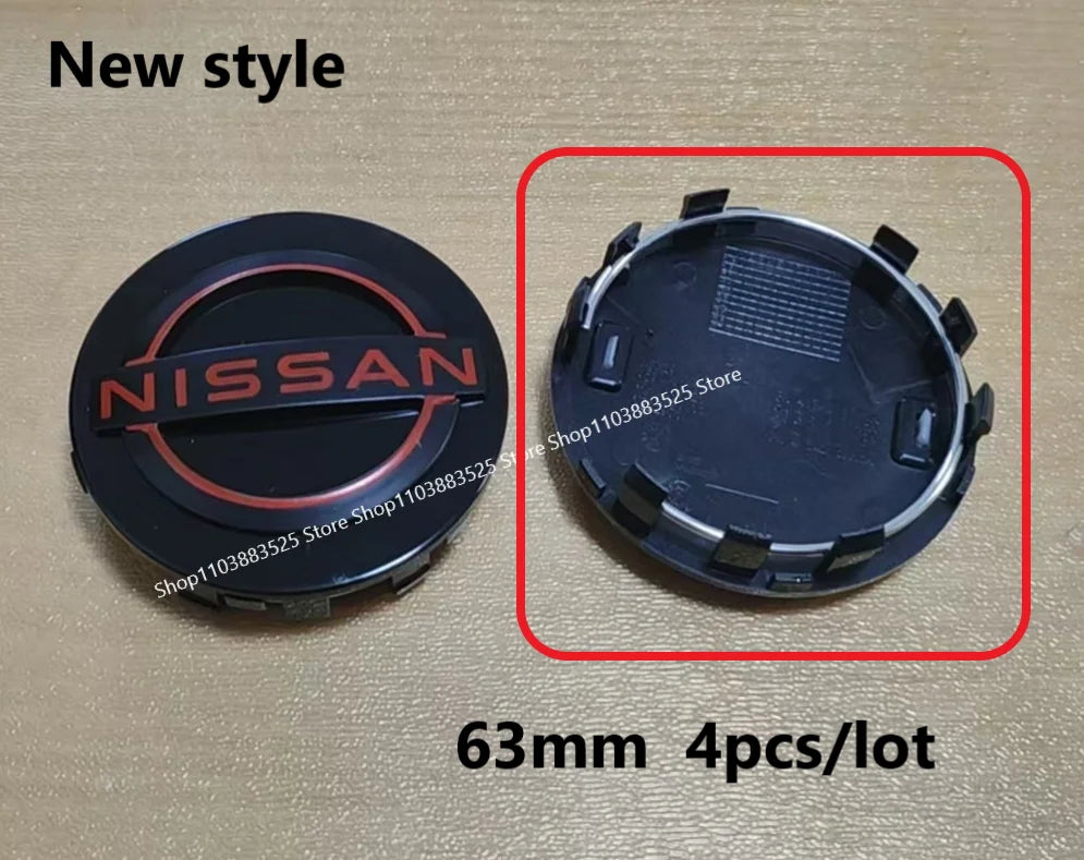 A set of four black hub caps for a Nissan wheel, shown in two views.