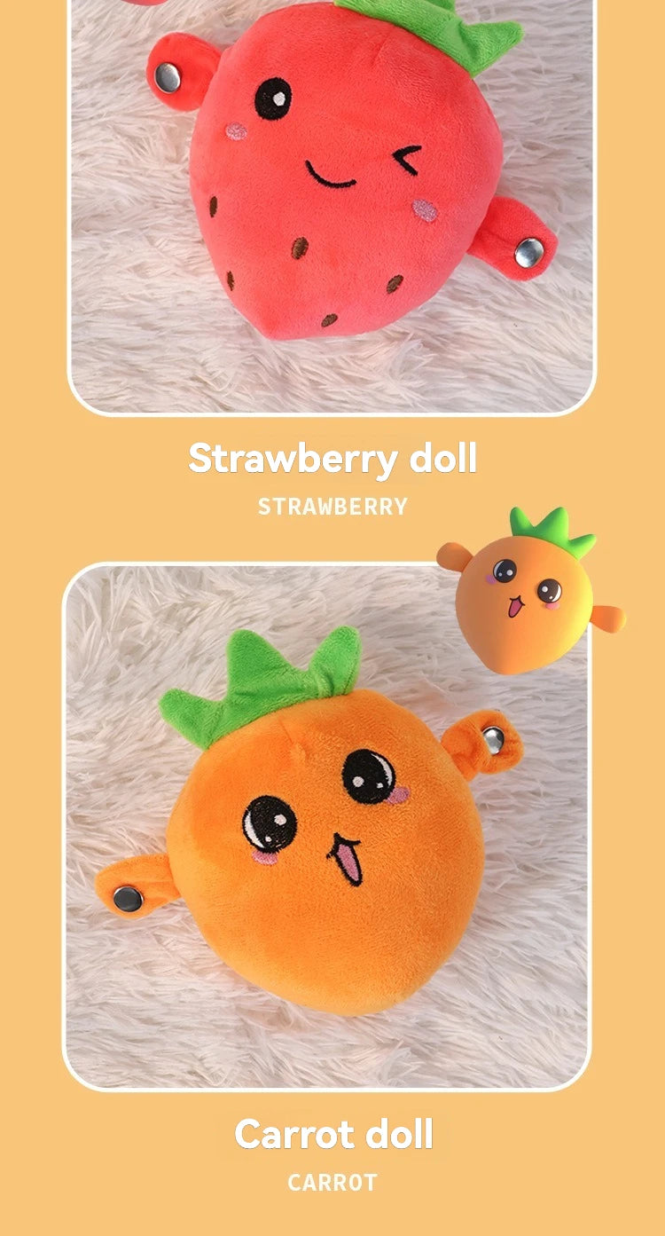 Two plush dolls shaped like a strawberry and a carrot resting on a white fuzzy surface.