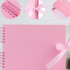Pink scrapbook album with pink ribbon details and loose-leaf pages