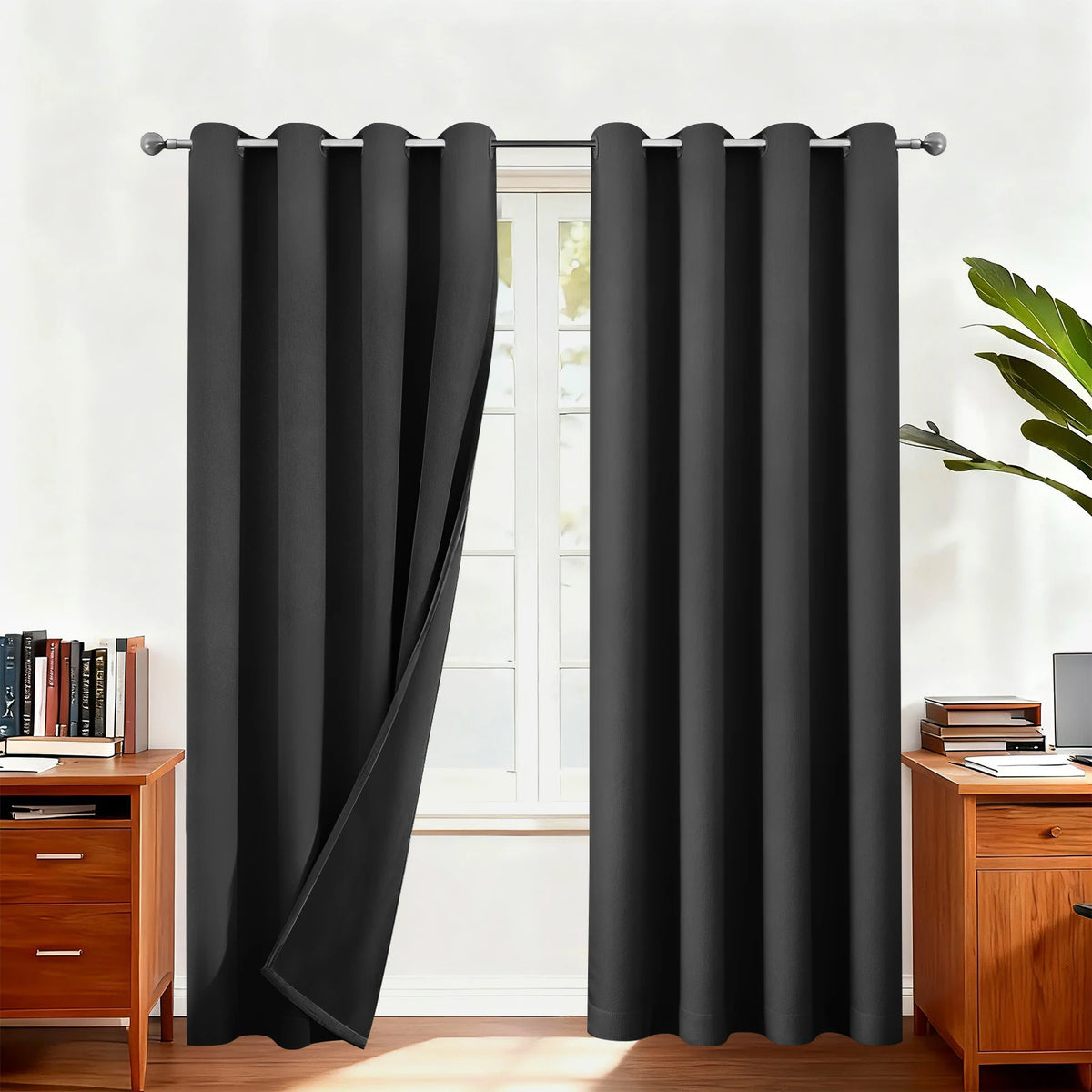 Blackout curtains hanging on a rod in a window frame