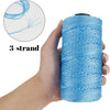 A hand holds a spool of bright blue 3-strand ice silk crochet yarn for knitting and DIY crafts.