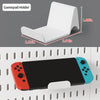 A white gamepad holder is shown next to a black tablet, demonstrating its use as a desktop organizer.