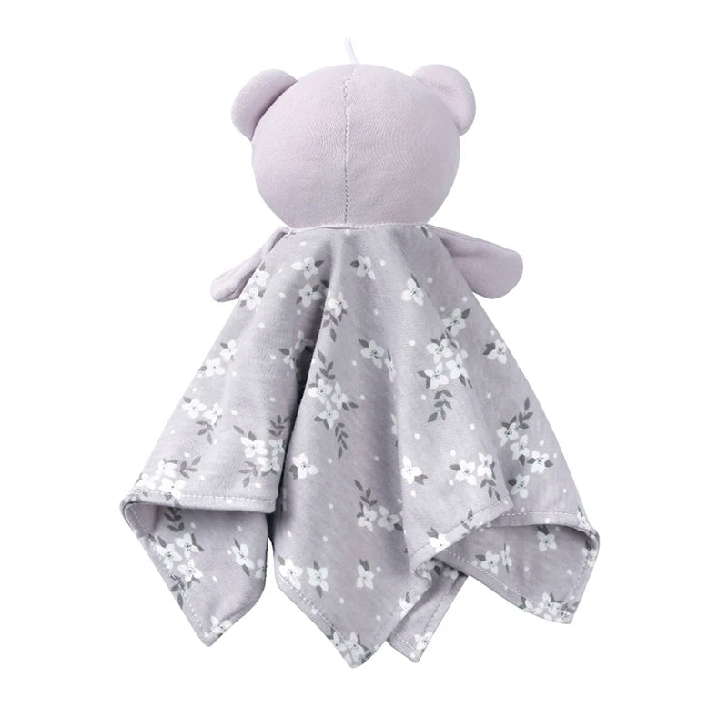 A soft lavender stuffed animal with a floral patterned fabric covering.
