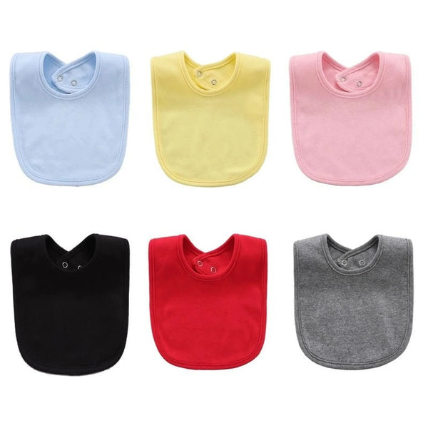 A set of five soft cotton baby bibs in light blue, yellow, pink, black, and red.