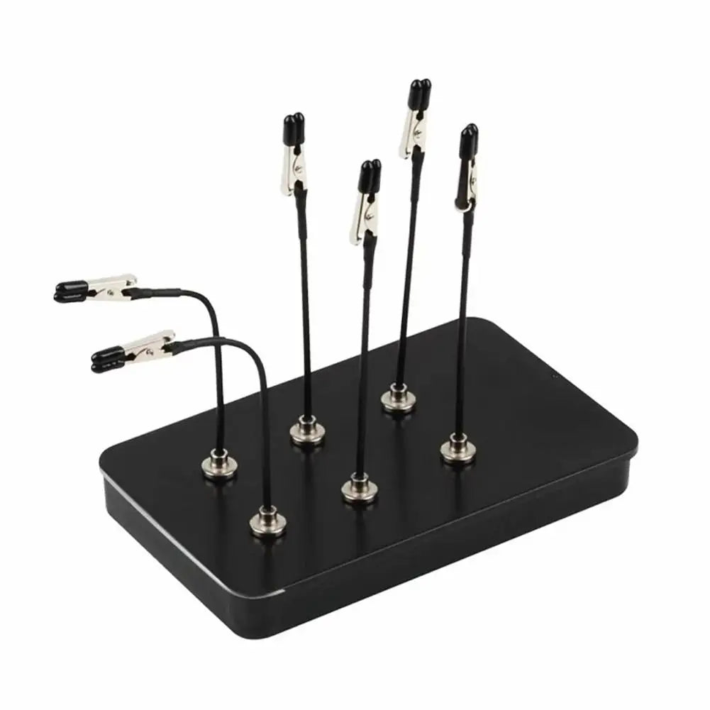 A black magnetic helping hands tool with flexible gooseneck arms and alligator clips.