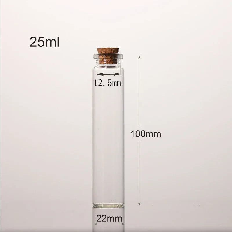 A clear glass bottle with a cork stopper, labeled 25ml, and marked dimensions of 100mm height and 22mm diameter.