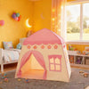 A pink flower playhouse tent for kids stands on a rug in a brightly lit room.