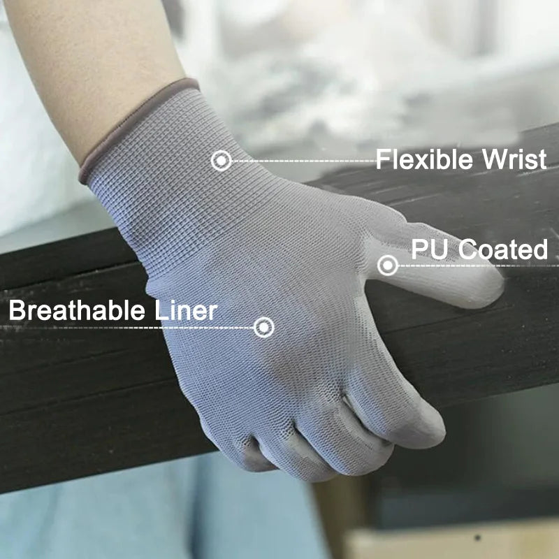 A hand wearing a gray PU-coated work glove is shown resting on a dark surface, highlighting the flexible wrist and breathable