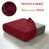 A deep wine red velvet fabric sofa cover displayed on a gray cushion.