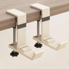 A beige foldable aluminum desk hook designed to hang bags and coats.