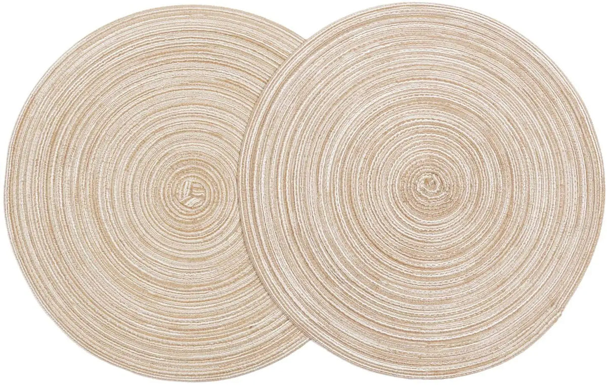 A set of six round, beige braided placemats with concentric circular patterns.