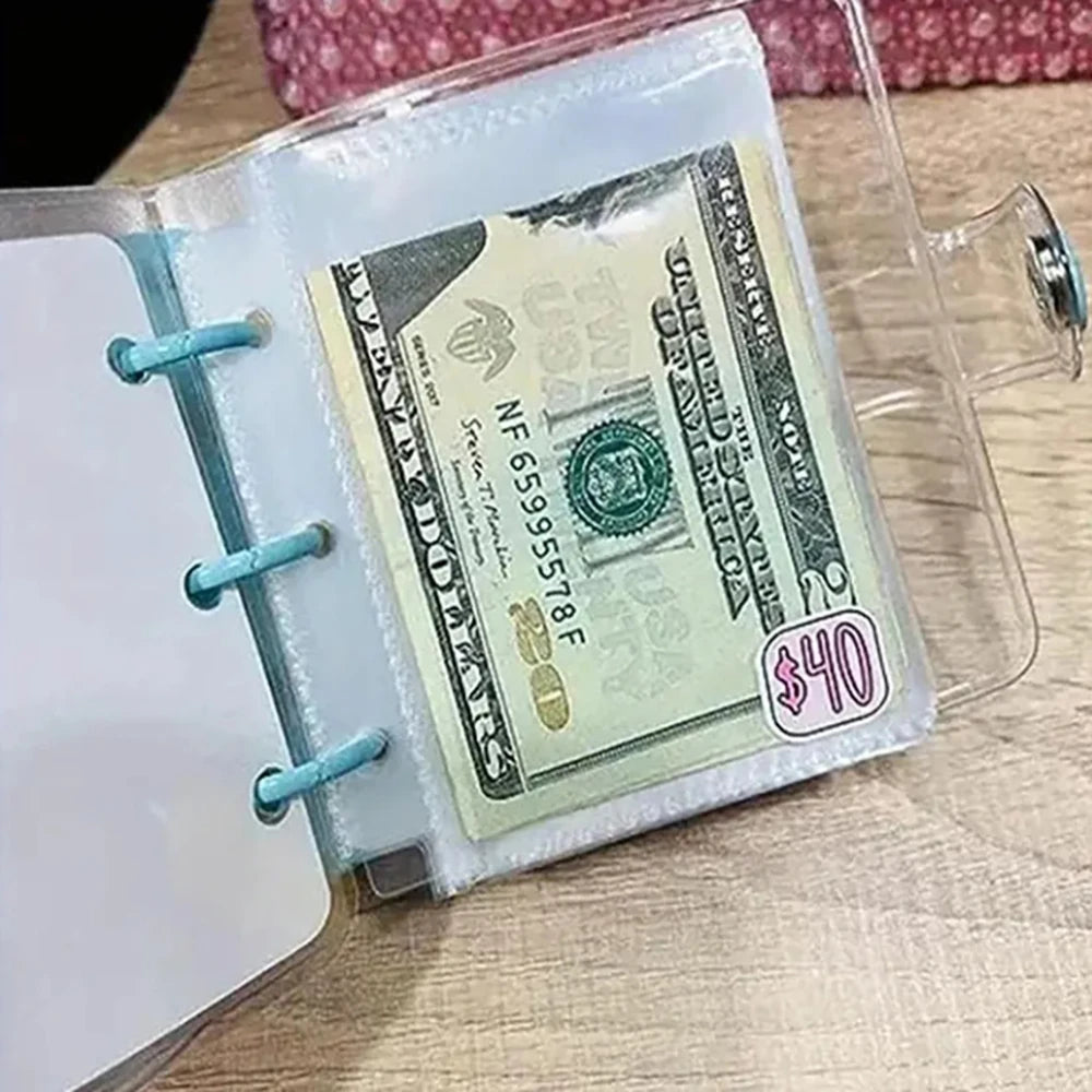 A clear plastic binder with an envelope containing a $40 US bill and a white sheet of paper.