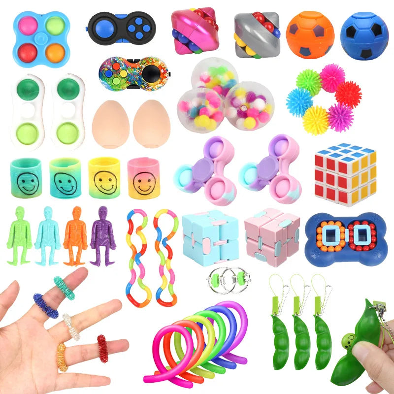 A collection of assorted fidget toys including spinners, pop-its, stress balls, and sensory items.