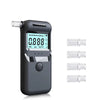 A portable digital breathalyzer device in gray with an LCD display and five clear glass mouthpieces.