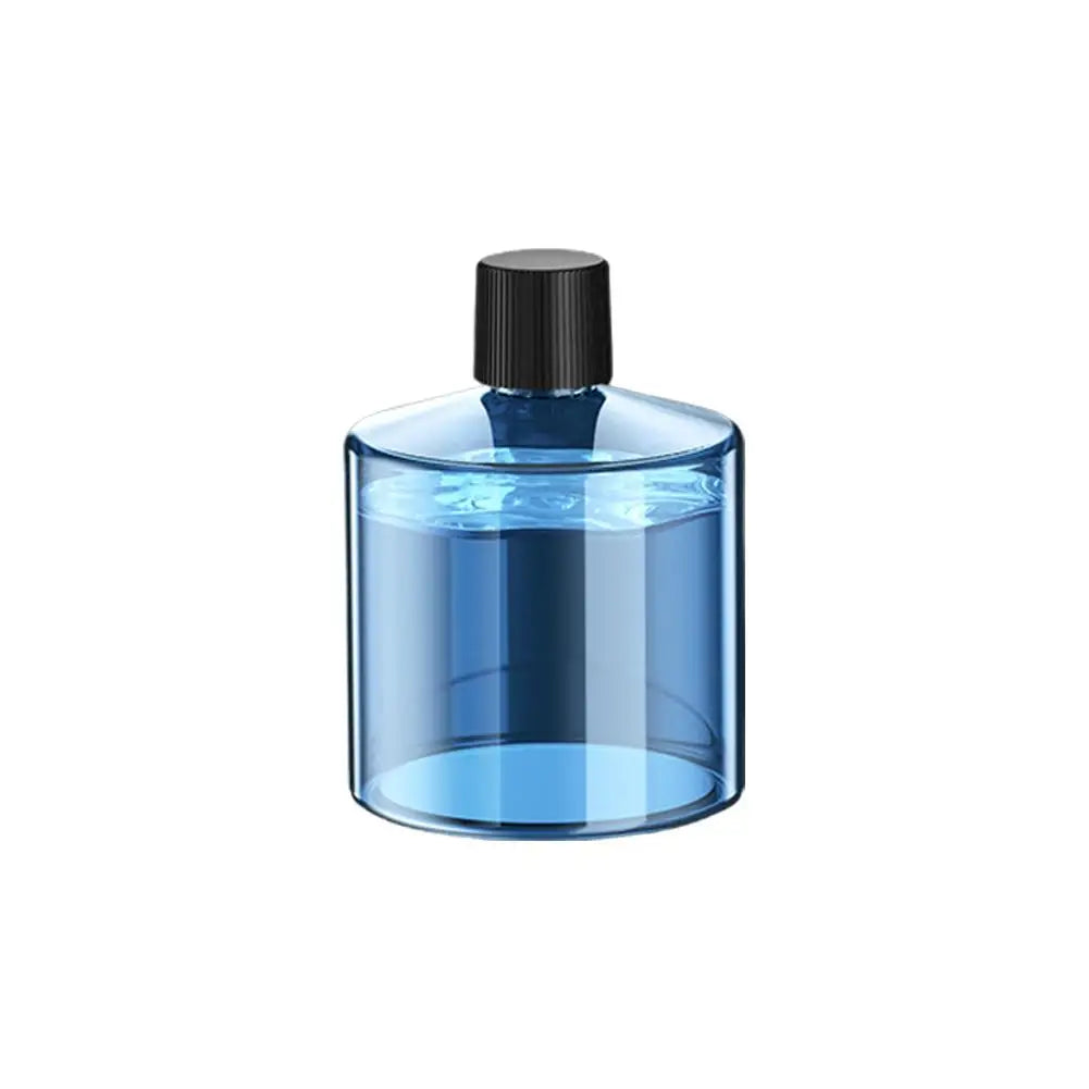 A clear glass car aroma diffuser bottle with a black cap and blue liquid inside.
