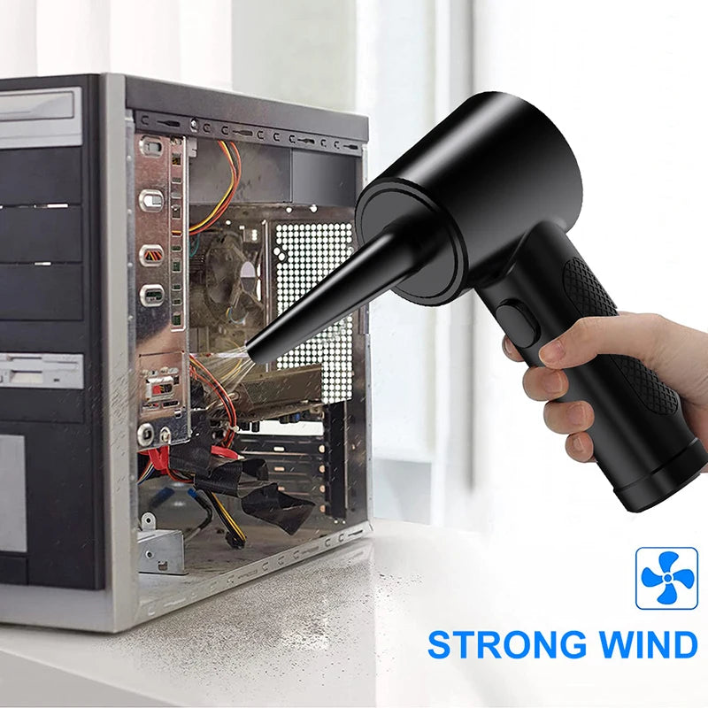 Eine Hand hält einen schwarzen kabellosen Elektrodüser, der einen starken Windstrahl aus der Düse zeigt.