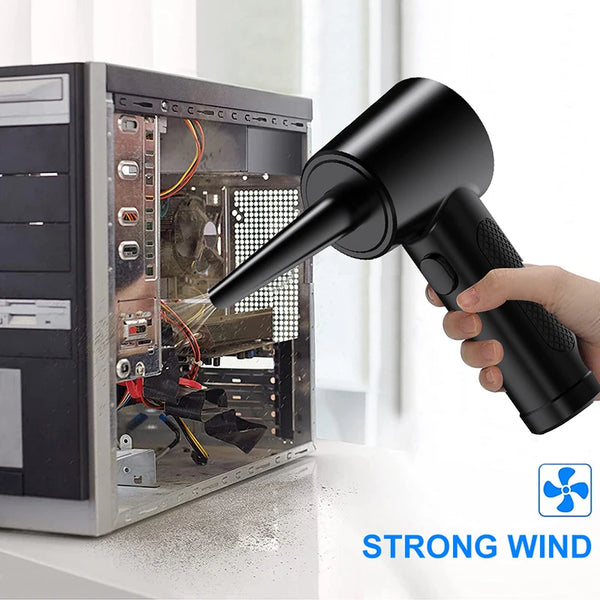 Eine Hand hält einen schwarzen kabellosen Elektrodüser, der einen starken Windstrahl aus der Düse zeigt.