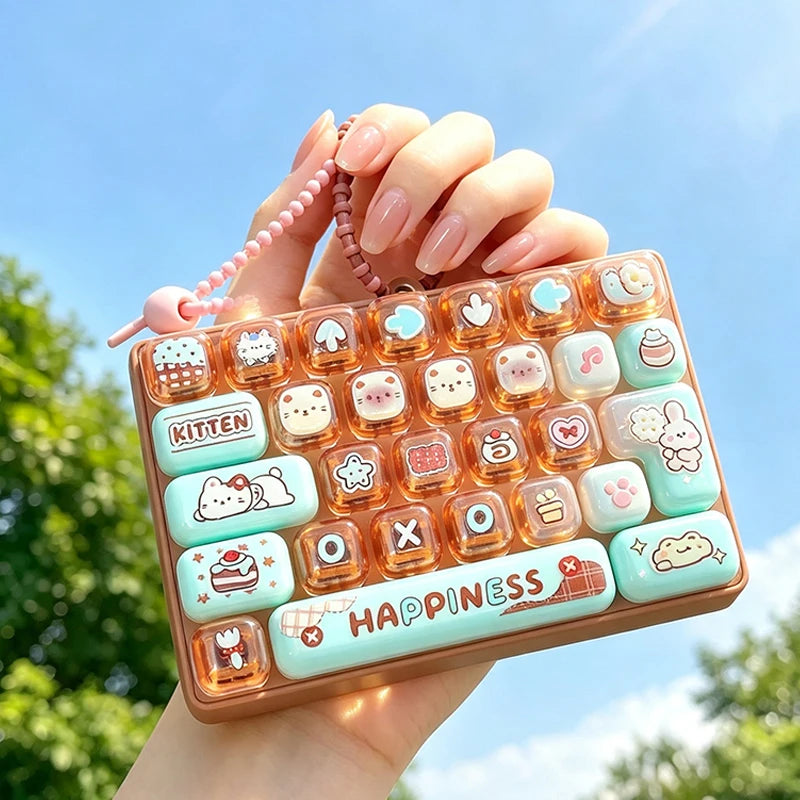 A hand holds a colorful cartoon keycap fidget keychain with various pastel-colored buttons outdoors.