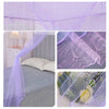 Purple princess-style lace canopy mosquito net draped over a bed and used as a window covering.