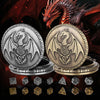 A silver and gold dragon-themed pocket watch dice case featuring two metal polyhedral dice against a dark background.