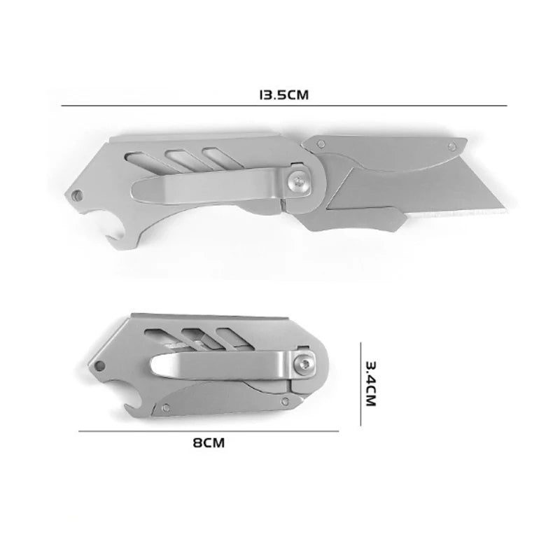Silver stainless steel folding utility knife with a blade visible and dimensions marked.
