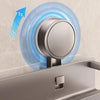 A close-up of a rustproof wall-mounted shower caddy being installed using suction cups, showing a time-lapse of the mounting 