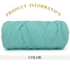 A skein of teal green thick polyester blend yarn for knitting and crochet.