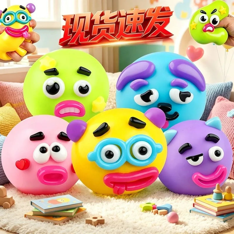 A collection of colorful face-changing squishy toys in green, blue, pink, and yellow are displayed on a white surface.