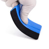 A hand is holding a blue suede felt squeegee with black rubber edges for vinyl wrap installation.