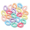 A collection of twenty colorful acrylic jewelry connector clasps with crystal accents in various pastel shades.