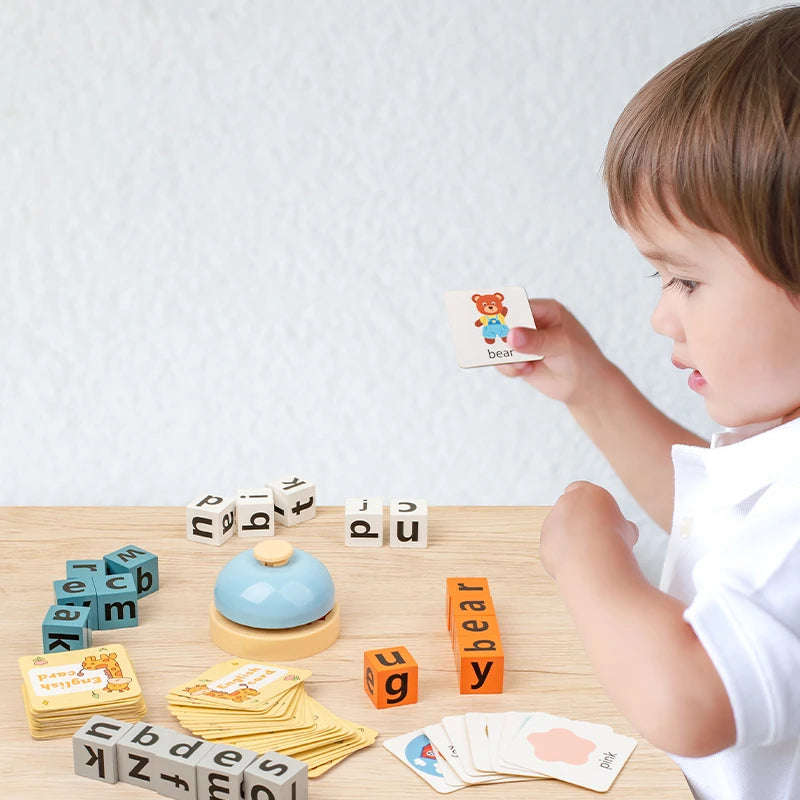 A young child is playing with a wooden spelling word game featuring letter tiles and a bear figure on a wooden table.