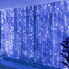 Blue LED curtain string lights with twinkling fairy lights illuminating a window or backdrop.